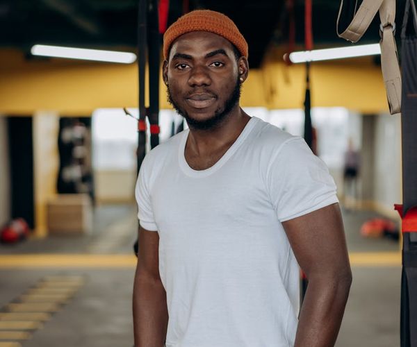 Man looking energetic and positive after a workout session.